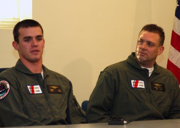 Photograph of AST3 Aaron Bean (left) being interviewed after his heroic role in rescuing Selendang Ayu crewmembers. (U.S. Coast Guard) Photograph of AST3 Aaron Bean (left) being interviewed after his heroic role in rescuing Selendang Ayu crewmembers. (U.S. Coast Guard)